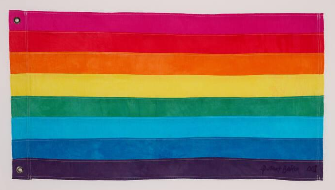 the original gay pride flag (replica by the creator) the LGBTQ rainbow flag with 8 colours