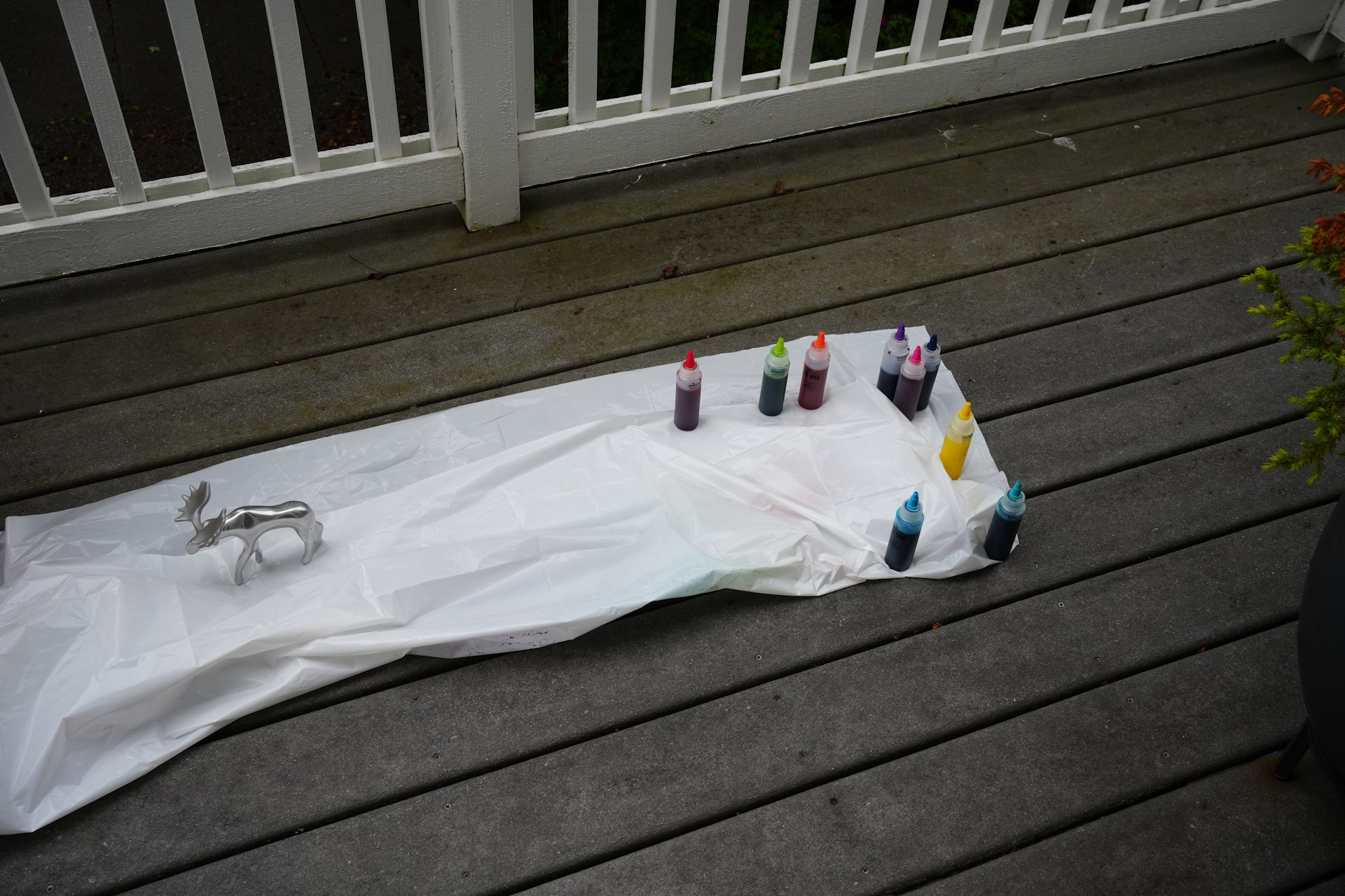 plastic sheet wrapped around shoelaces, with items weighing it down