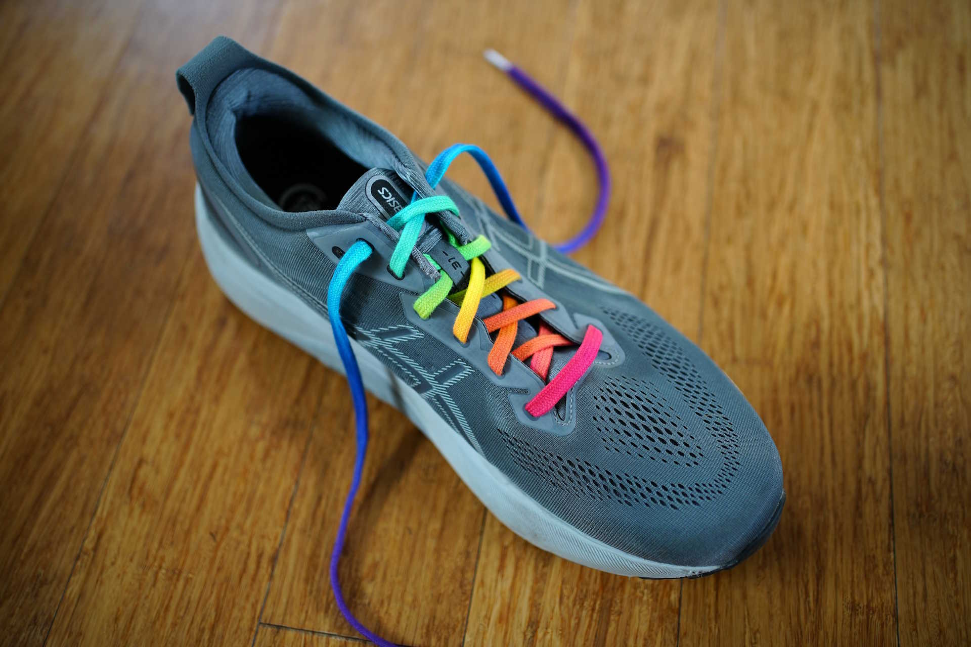 My shoe with my finished rainbow-coloured lace threaded and untied